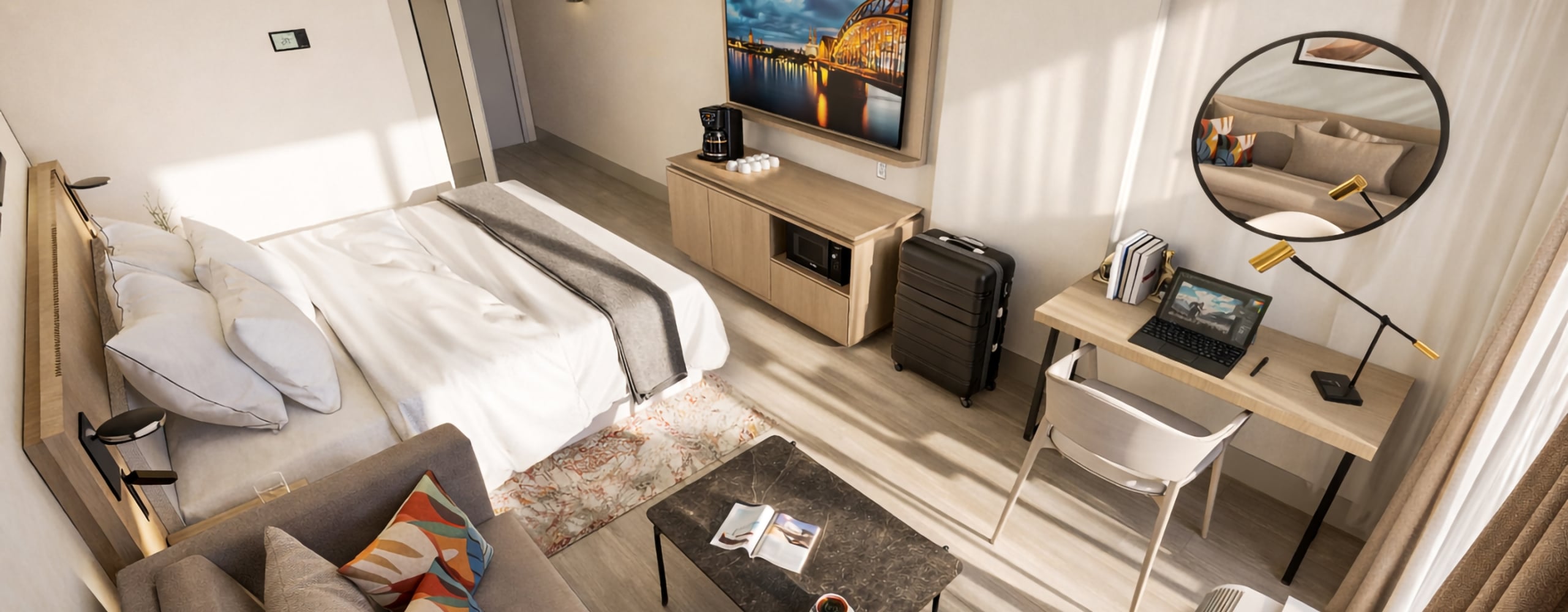 A modern hotel room features a bed, sofa, workstation with laptop, and TV showing a night bridge. Sunlight fills light wood and white walls; a thermostat reads "20".
