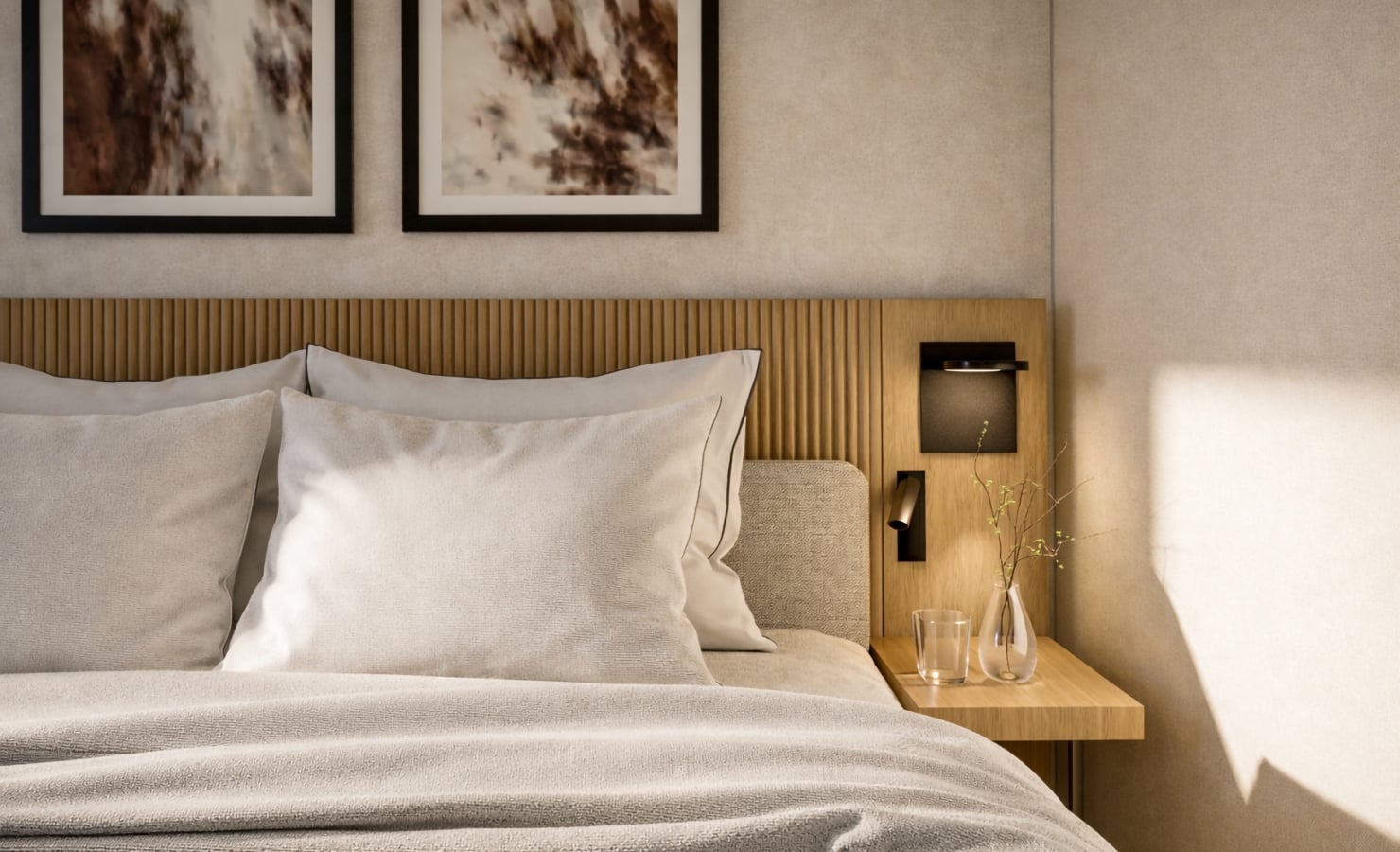 A neatly made bed with light pillows and blankets features a wooden headboard, abstract art, and a nightstand with a glass and vase, within a sunlit, modern bedroom.