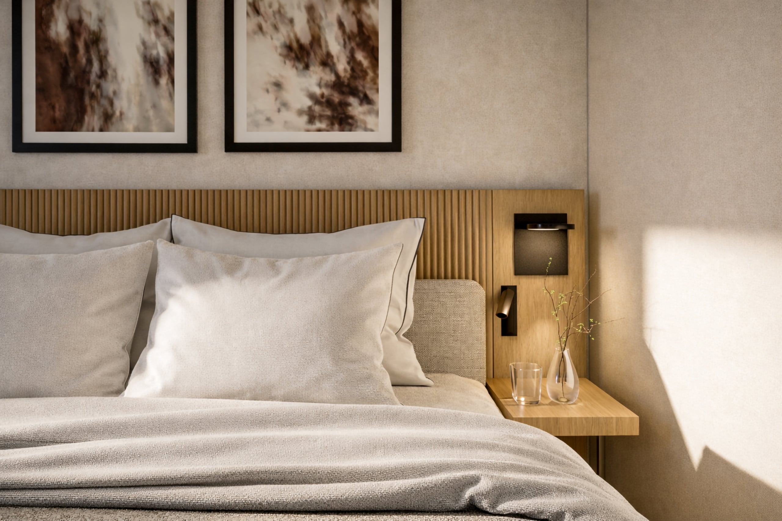 A neatly made bed with light pillows and blankets features a wooden headboard, abstract art, and a nightstand with a glass and vase, within a sunlit, modern bedroom.