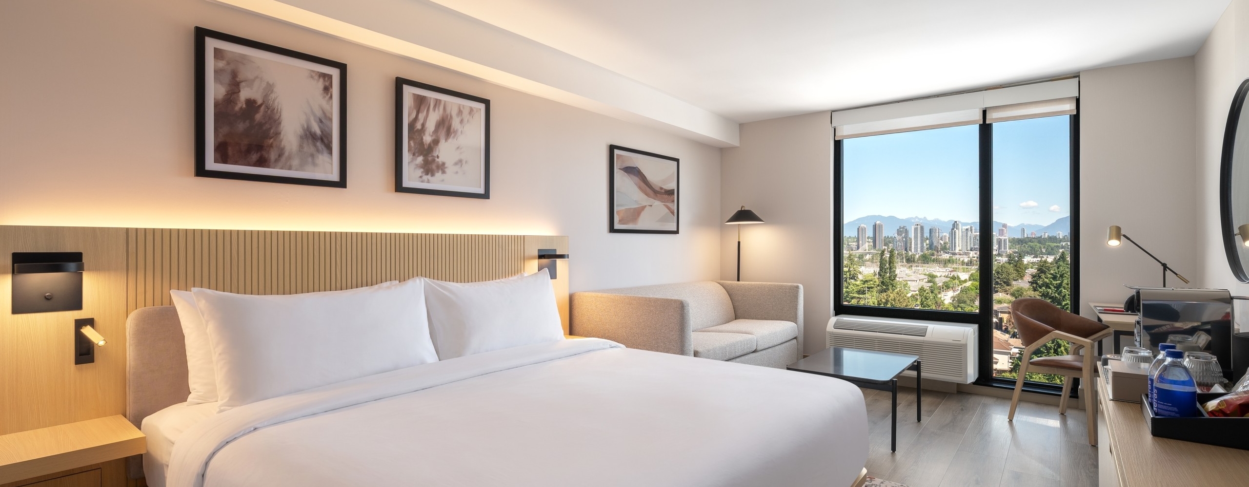 Hotel room with king size bed and mountain view